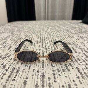 Elegant Gold and Black Sunglasses